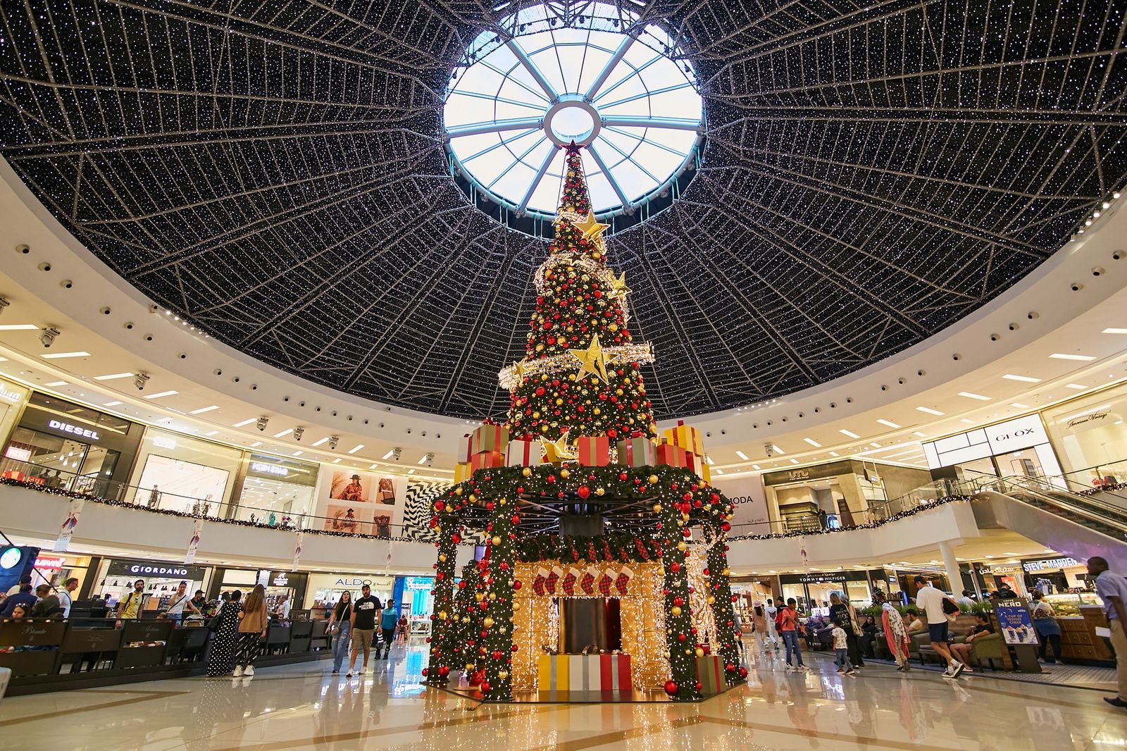 Christmas tree installed by Redfox under the glass dome of Dubai Marina Mall