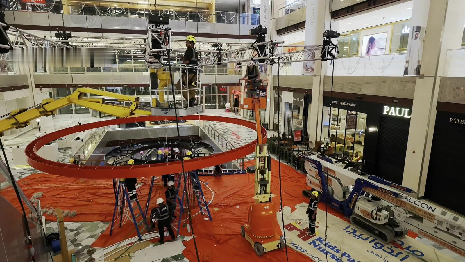 Redfox crew lifting a large ring frame from the protected atrium floor at The Galleria Mall, Abu Dhabi