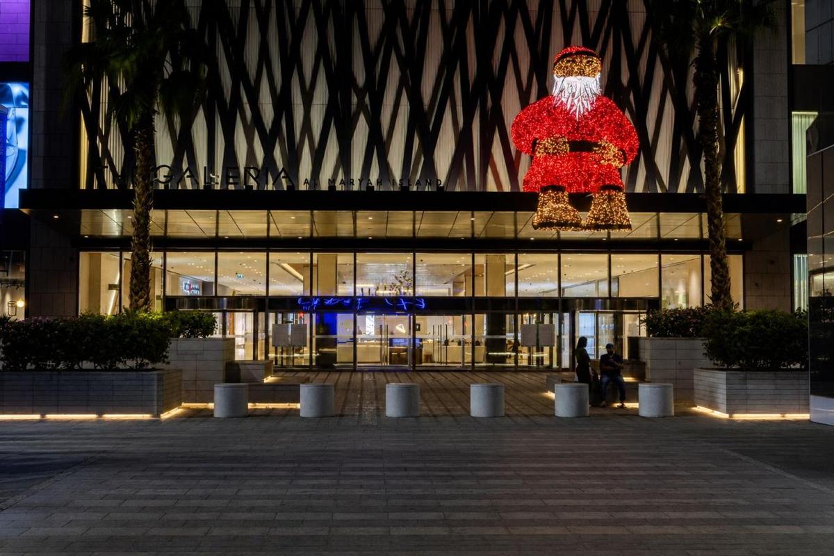 The Galleria Mall Santa facade in Abu Dhabi lit at night, installed by Redfox